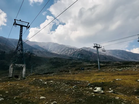 A mountainous area with a power line running through it.